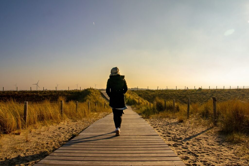 Woman enjoying simple healthy habits outdoors on a morning walk.