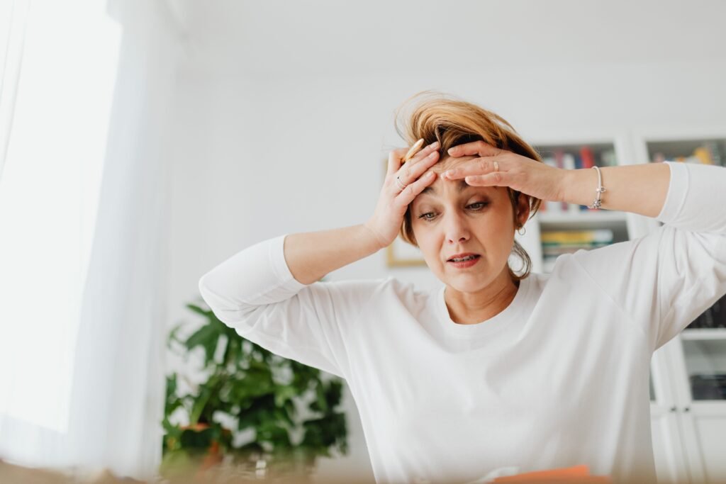 Woman feeling overwhelmed by trying to change too many habits at once.