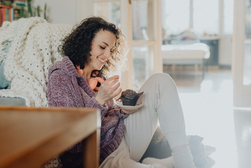 Woman enjoying chocolate mindfully as part of a balanced lifestyle.