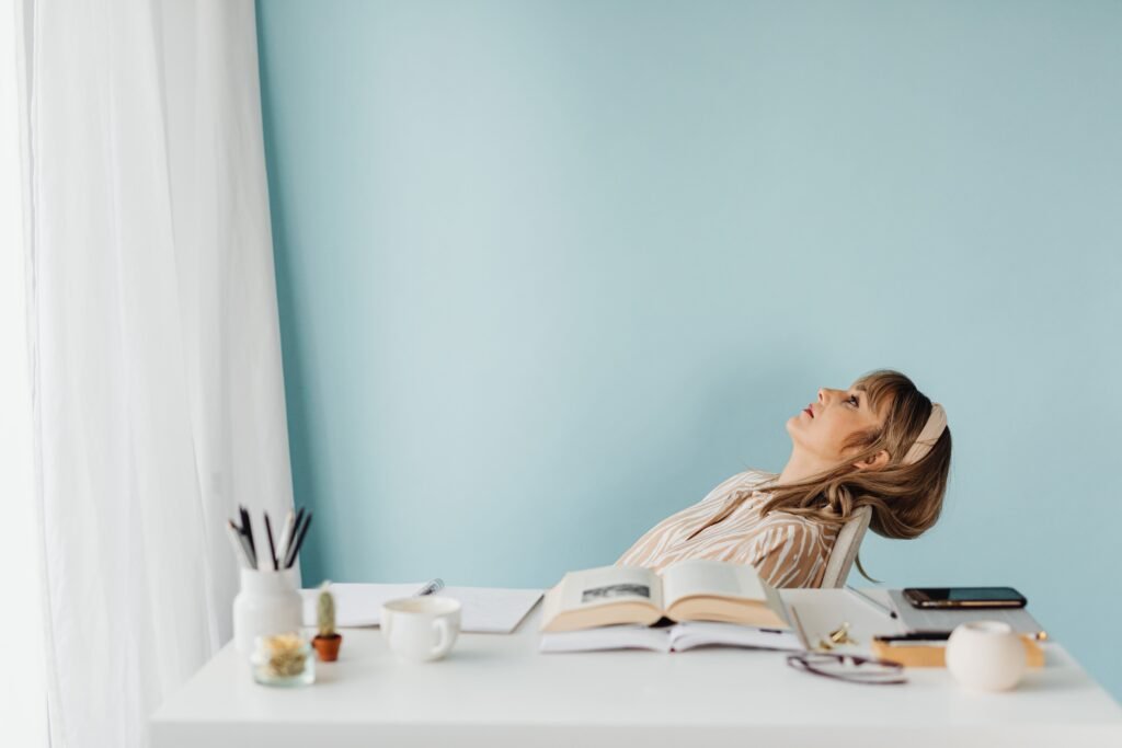 Woman feeling overwhelmed by too many goals and responsibilities.