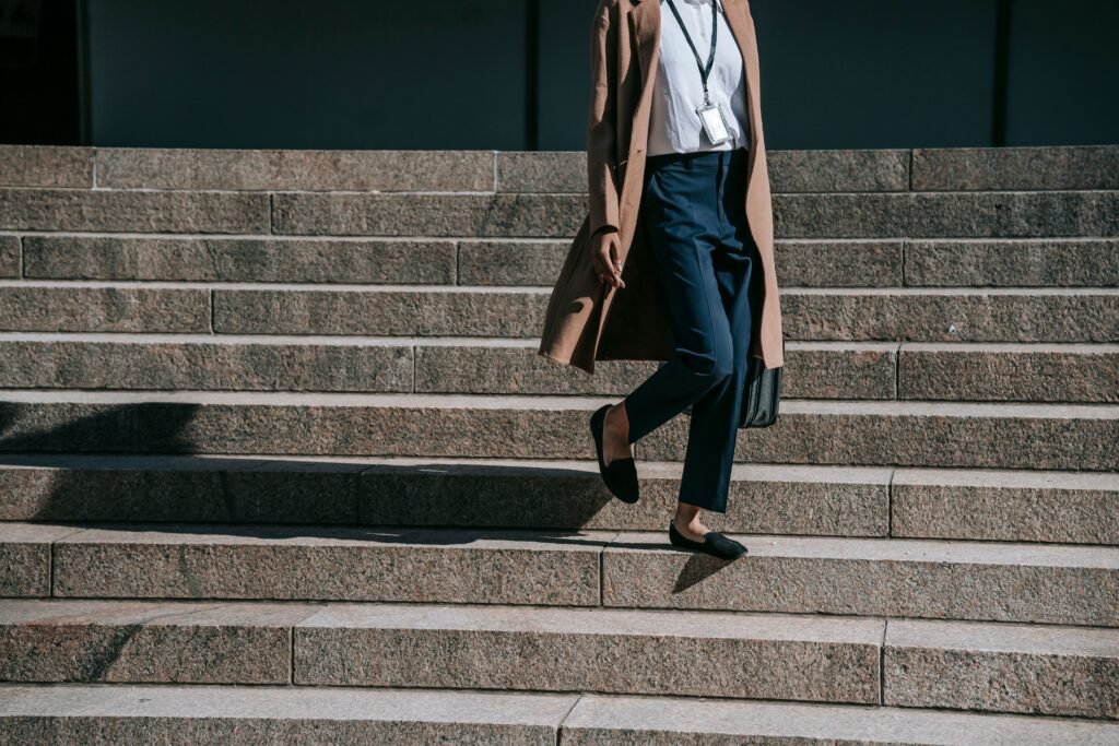 Woman taking a simple lunchtime walk to support health and wellbeing.