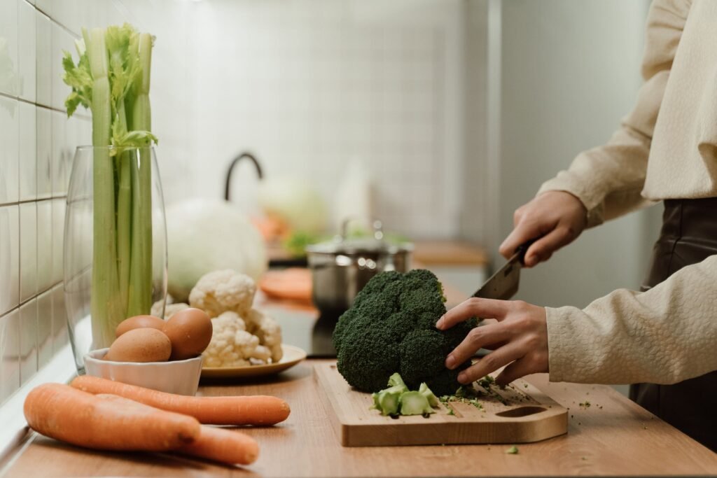 Woman preparing a balanced meal to support health and weight management after 40.
