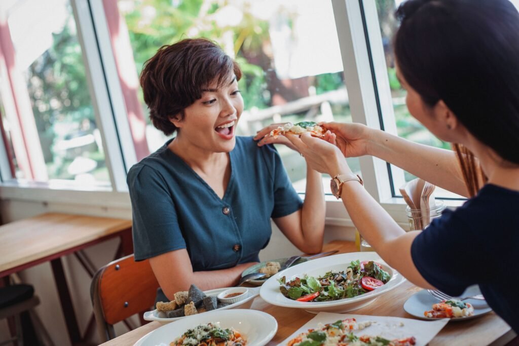 Woman enjoying healthy eating as part of a balanced lifestyle.
